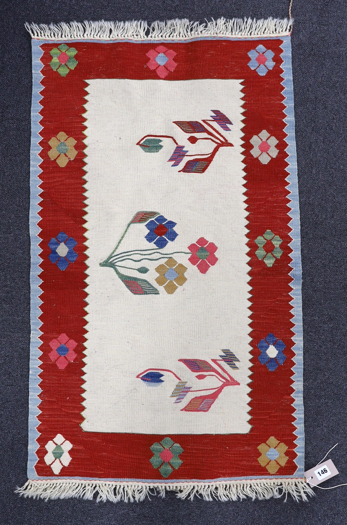 A Turkish floral mat, 100 x 60cm